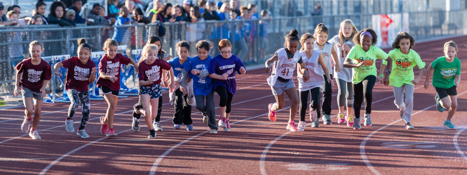 Students running in cross country race.