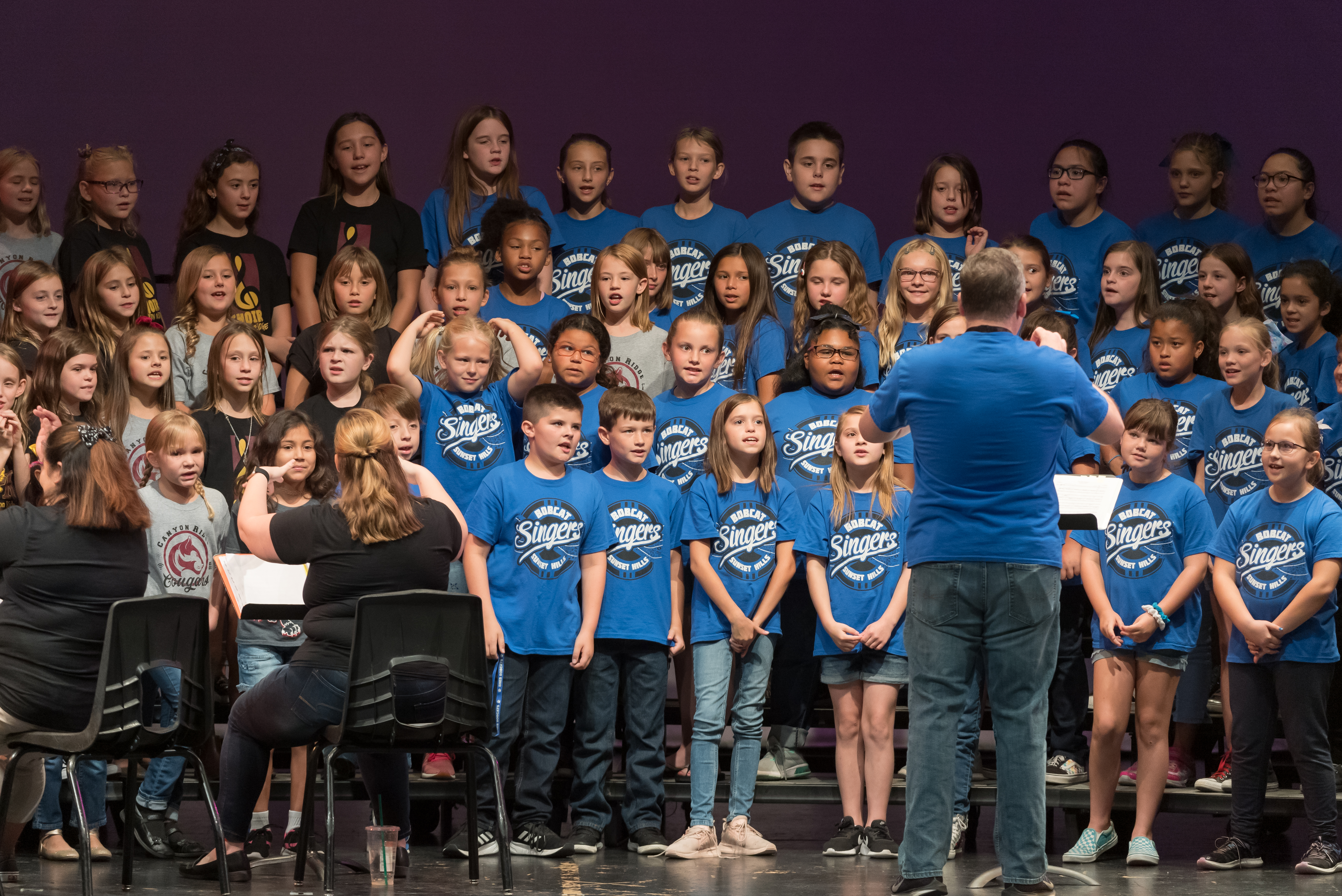 Students singing in choir. 
