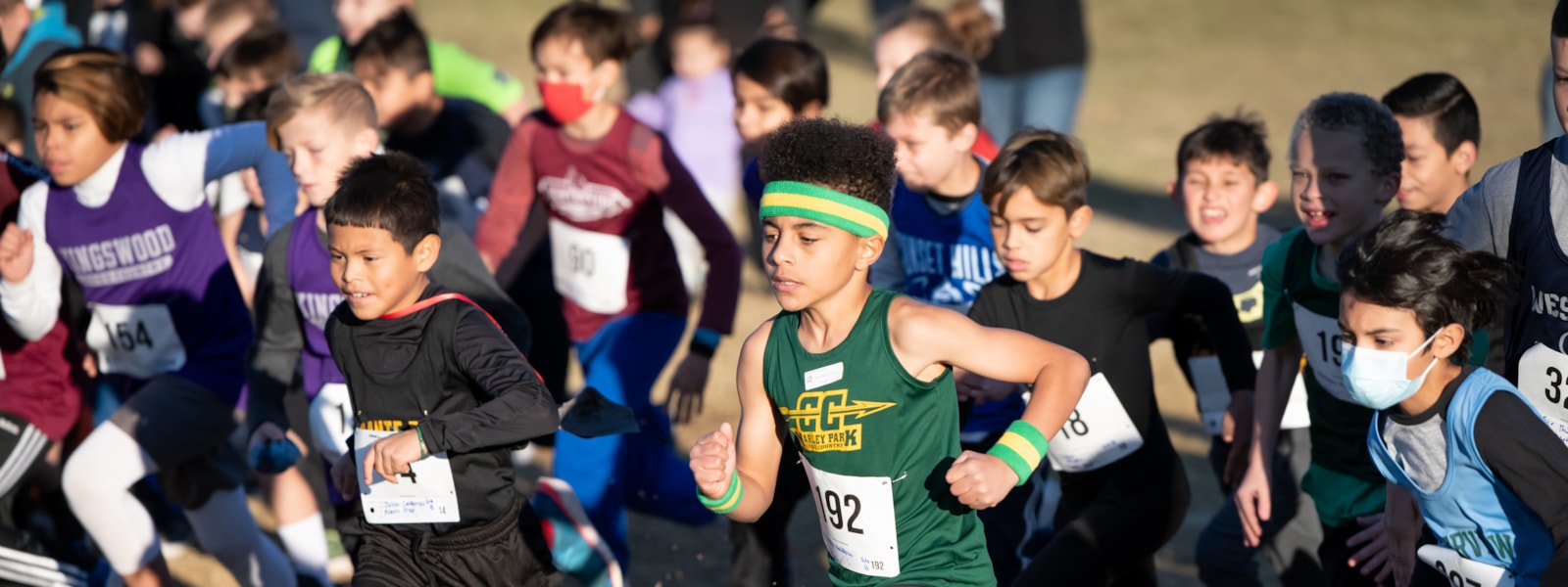Student running in cross country race.