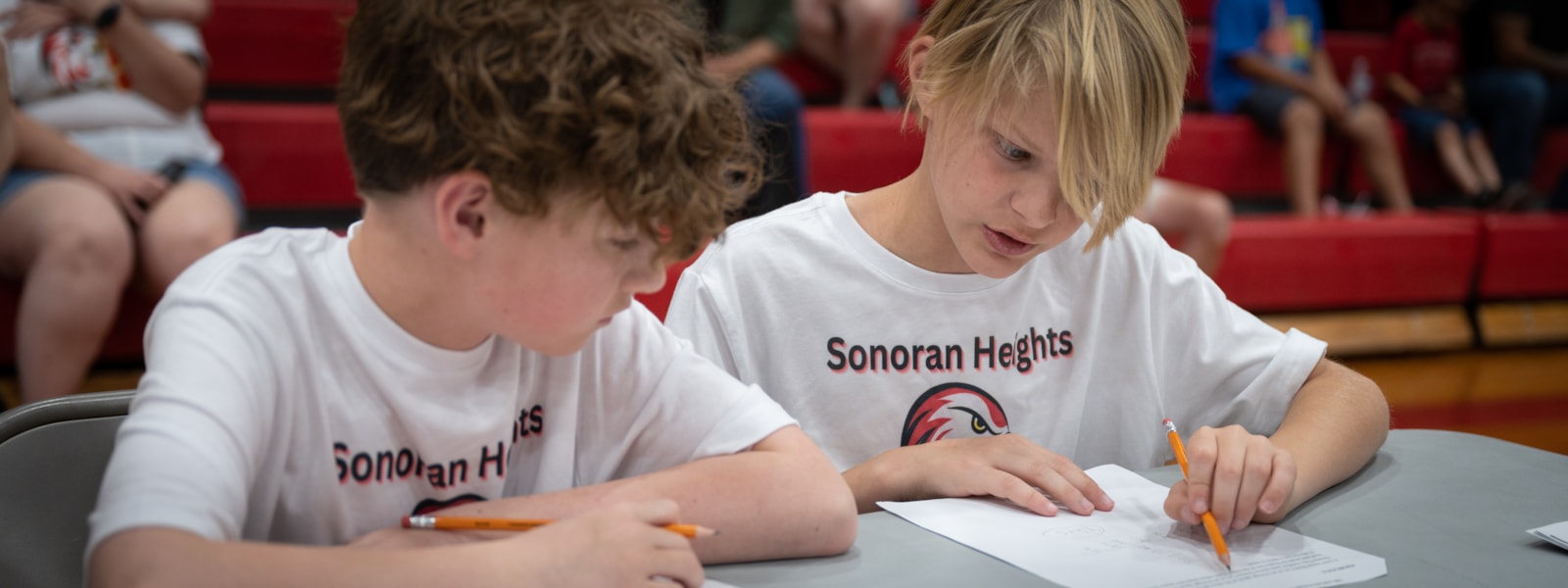 Two students from Sonoran Heights Middle School work on a math problem together at the Dysart Math Challenge.