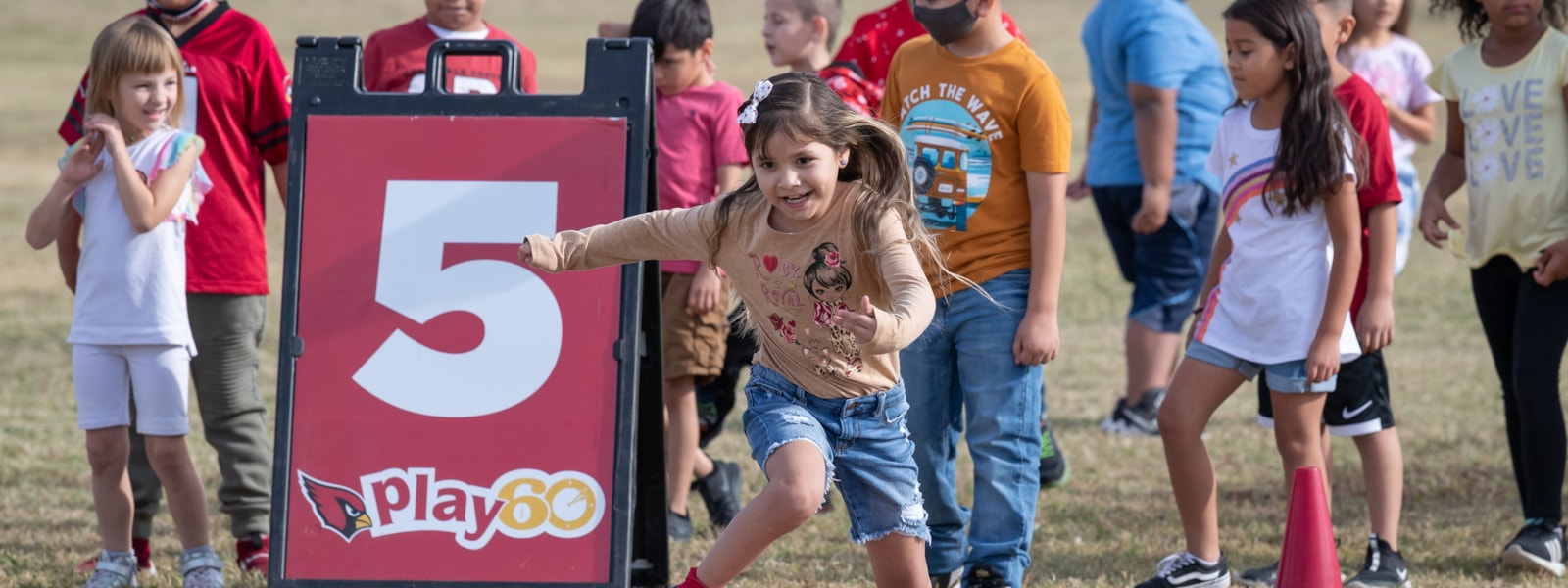 Students running in Play 60 Campaign