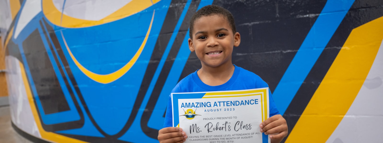 Student with amazing attendance certificate