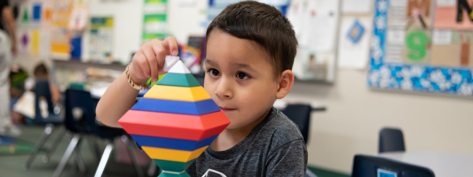 Preschool student with building blocks