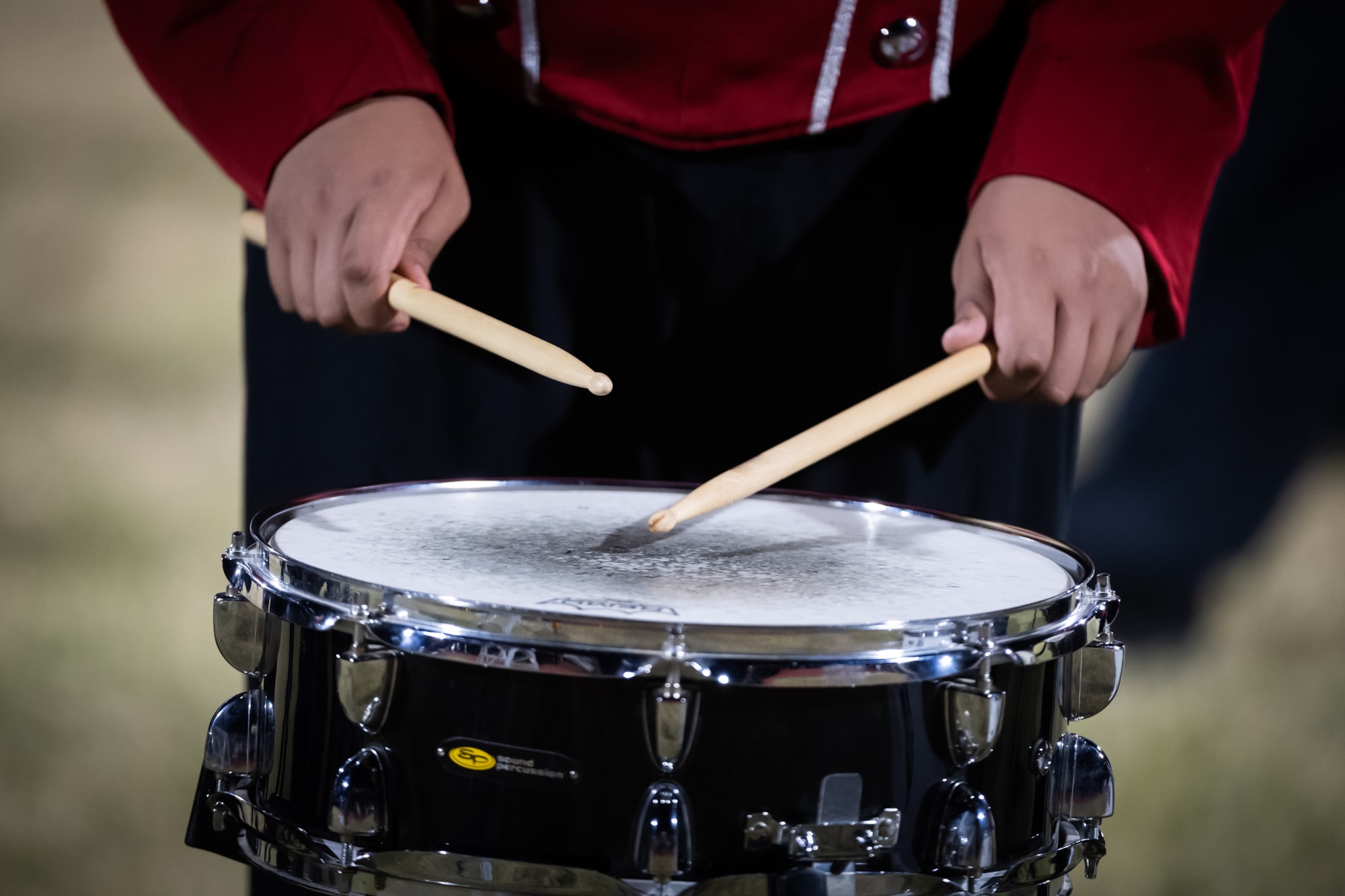 Student playing snare drum. 
