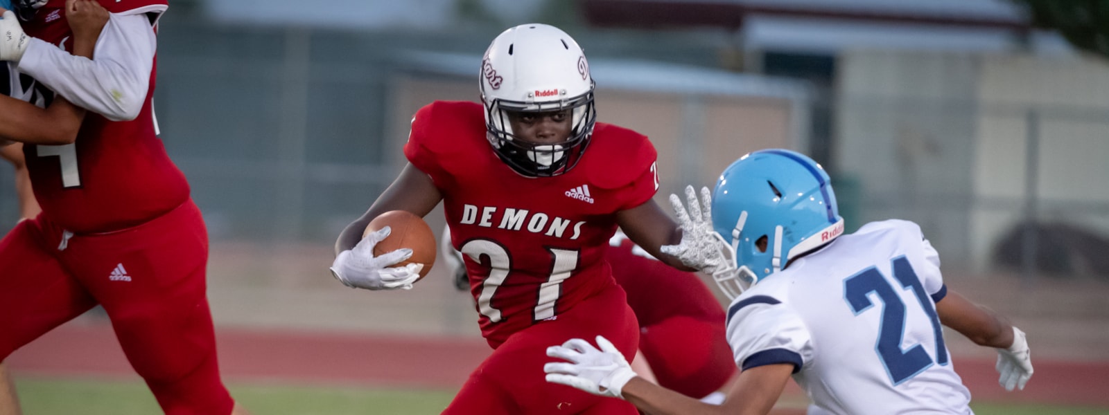 A Dysart football player running with the ball. 