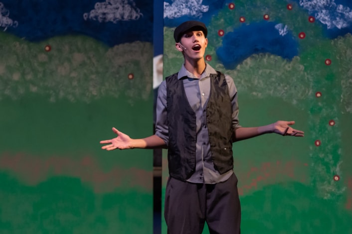 Student singing in willow canyon theatre production