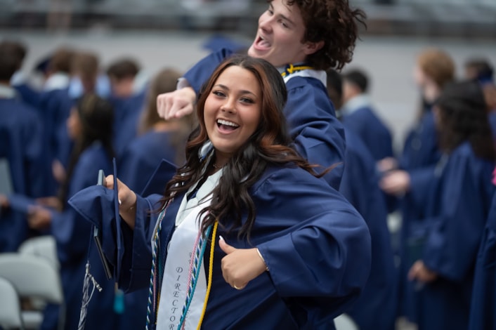 Willow canyon graduate celebrating during a ceremony.
