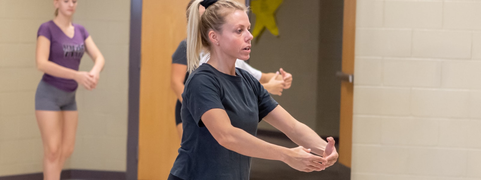 Valley Vista High School dance teacher, Amy Crow works with students
