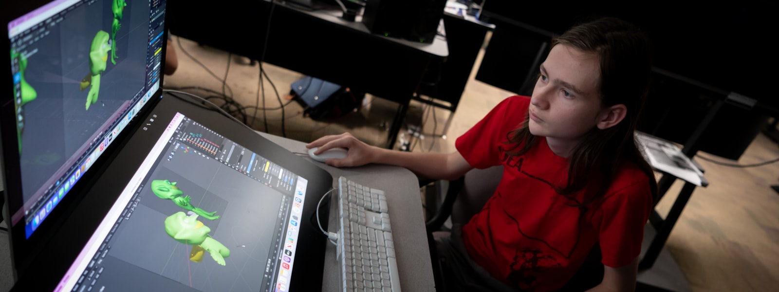 A student works on an animated character on a computer