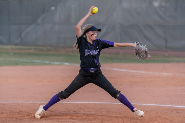 Valley Vista high school softball player pitching during a game.