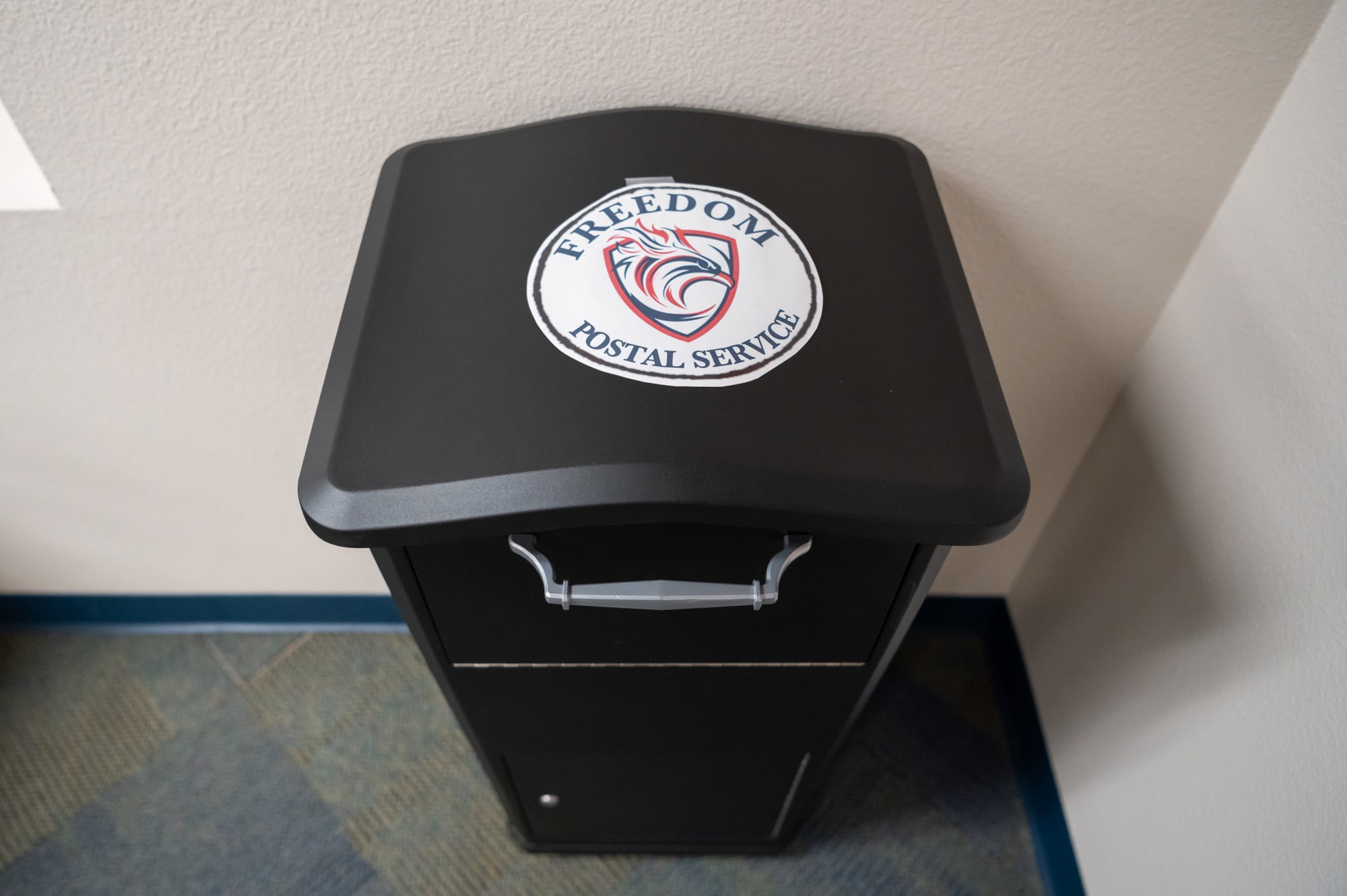 The central mail drop is seen in the front area of Freedom Traditional Academy.  Parents and staff can drop off their letters in this large mail box, which will be collected, sorted, and delivered on each Friday at the school.