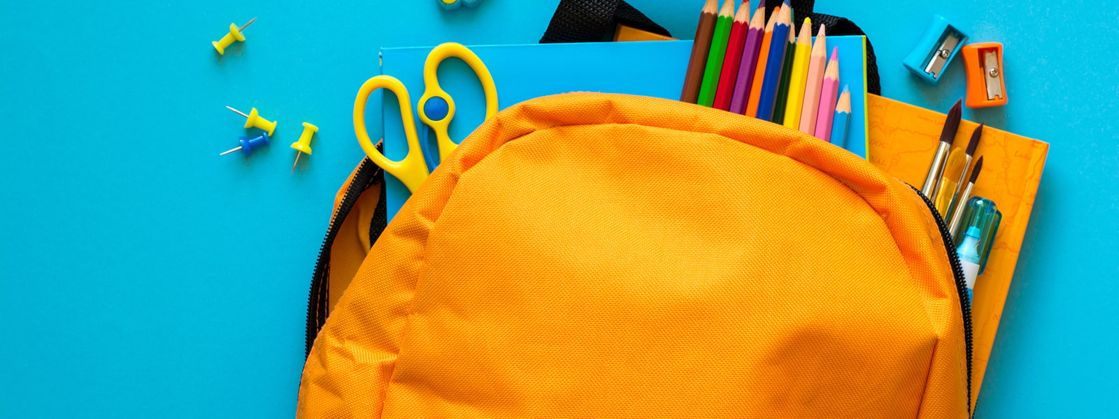 orange backpack with supplies