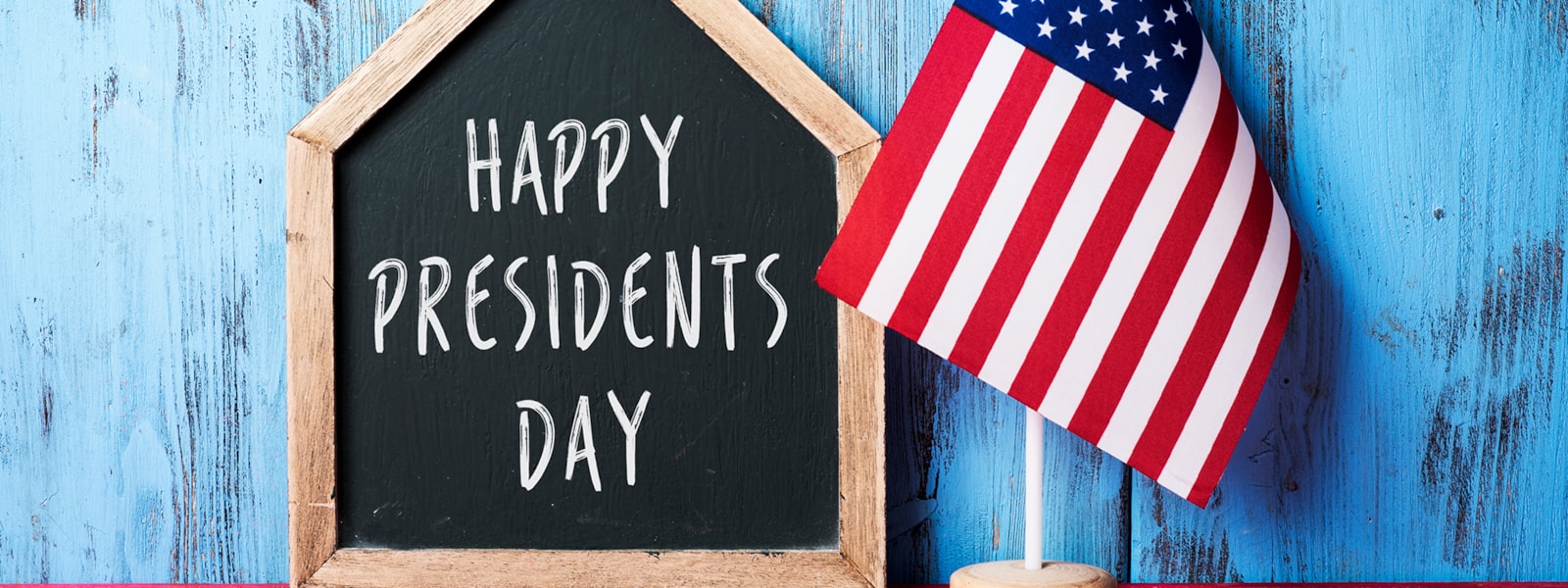 Happy Presidents Day sign and flag