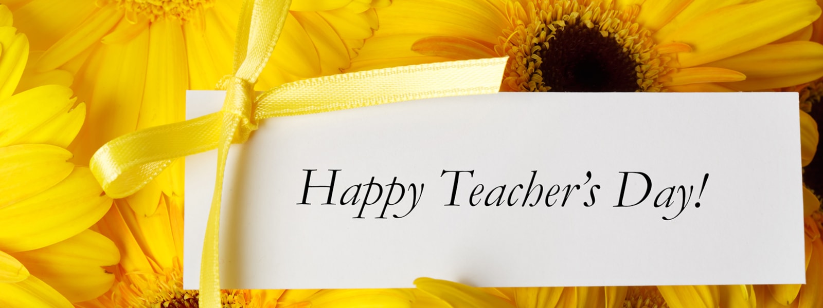 flowers with a Happy Teacher's Day note