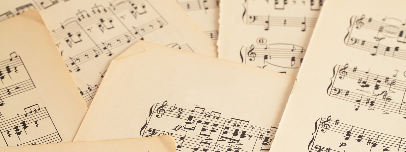 Pages of sheet music layered on top of each other