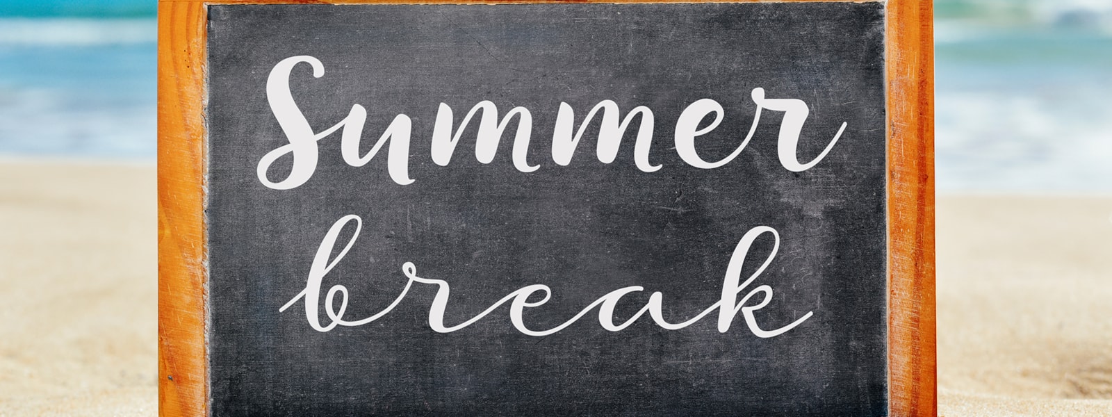 A chalk board sign with summer break 