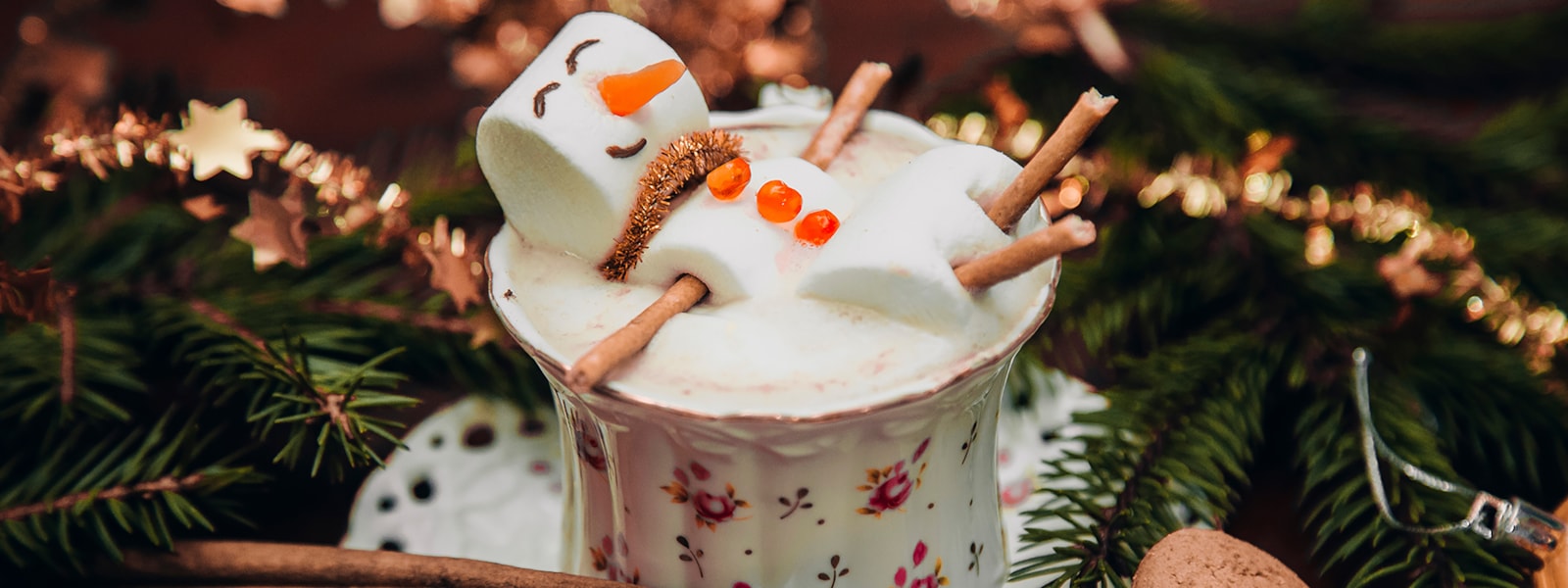 marshmallow snowman in cup of hot chocolate