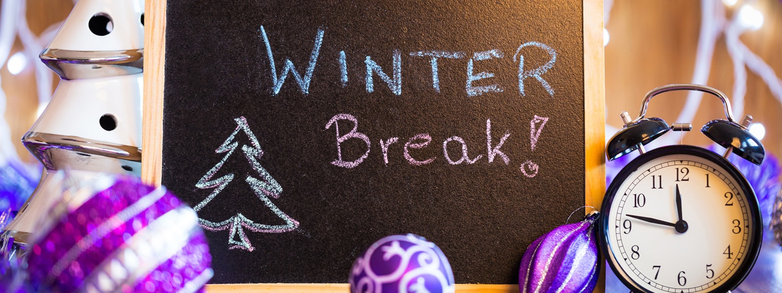 chalk board with winter break on it and a clock.