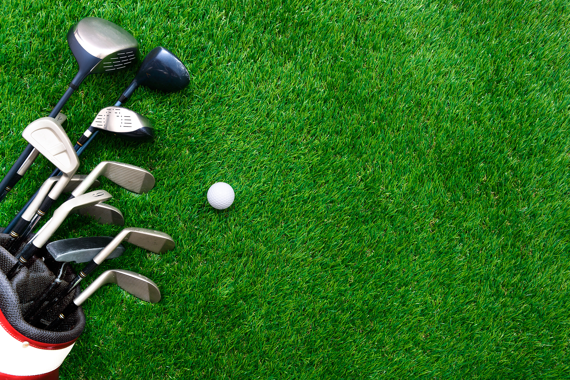 golf clubs and grass