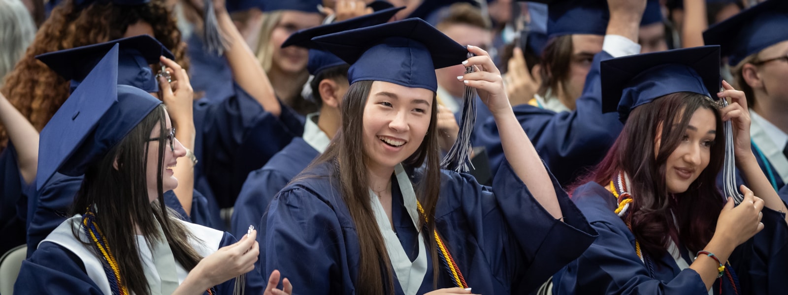 Graduates smiling at graduation