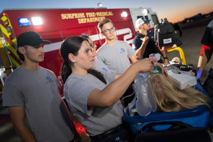 students training on emergency medical services tactics with surprise firefighters