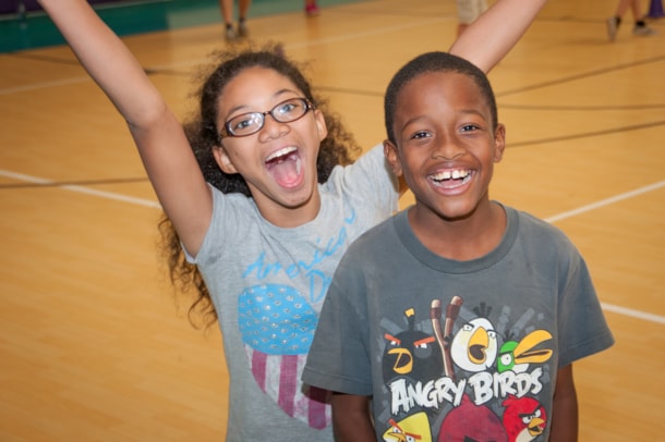students smiling for camera at camp