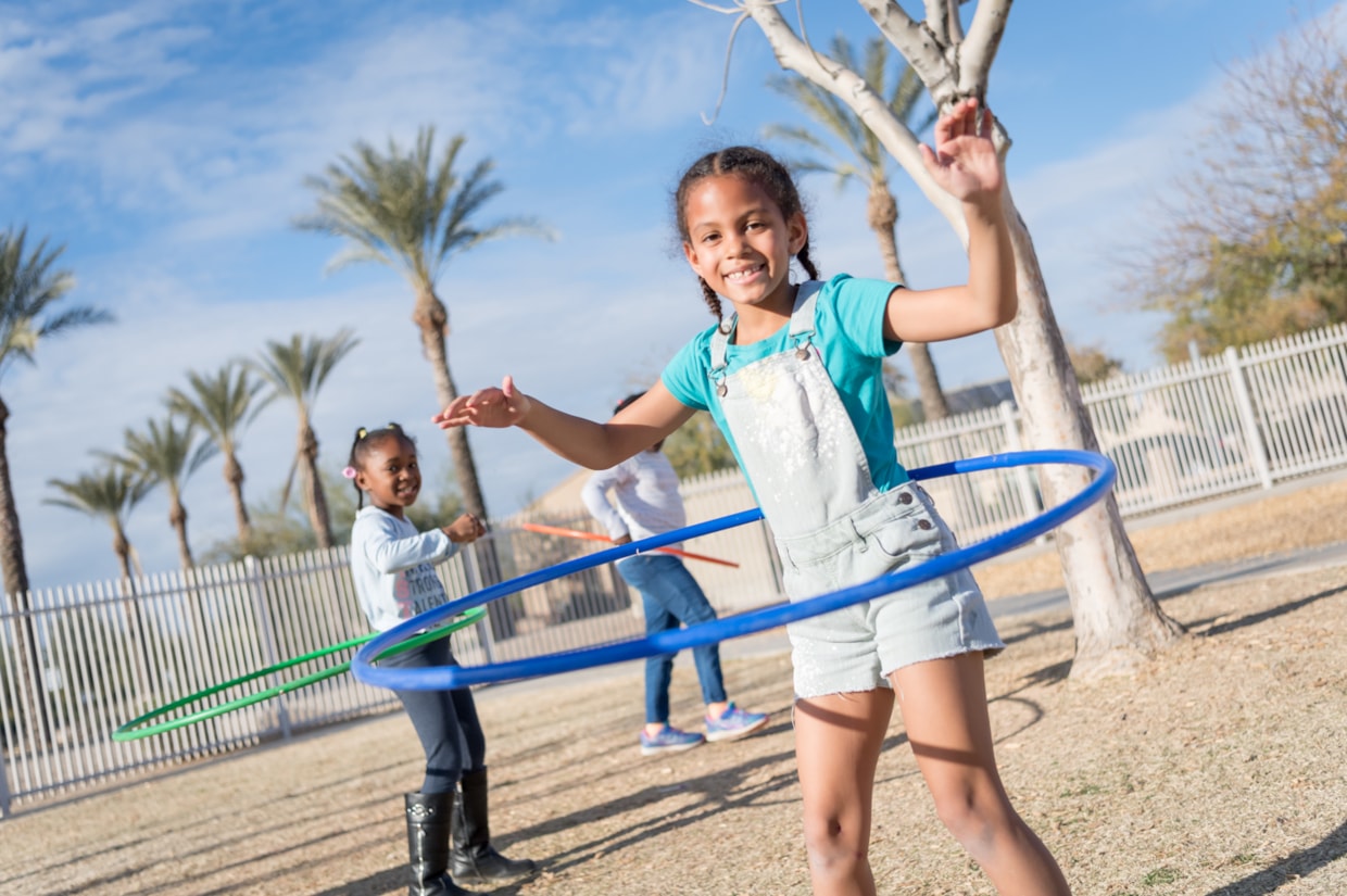 Girls hula-hooping