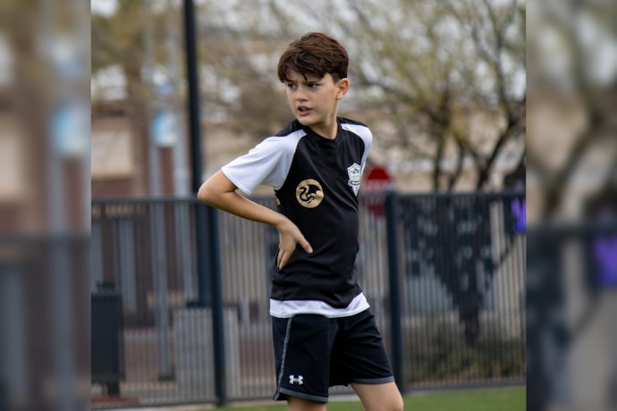 Brayden in a soccer uniform on a field