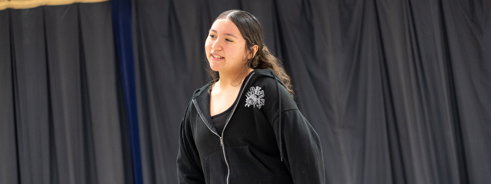 student performing on stage