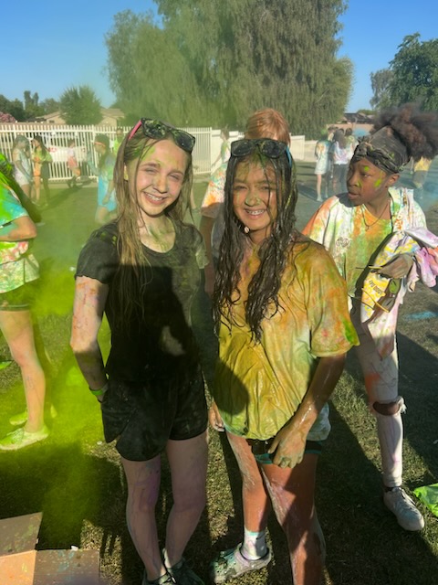 kids covered in paint and chalk at color wars