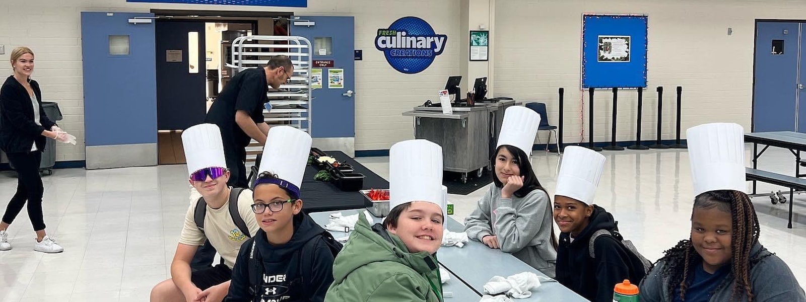 students cooking with chef