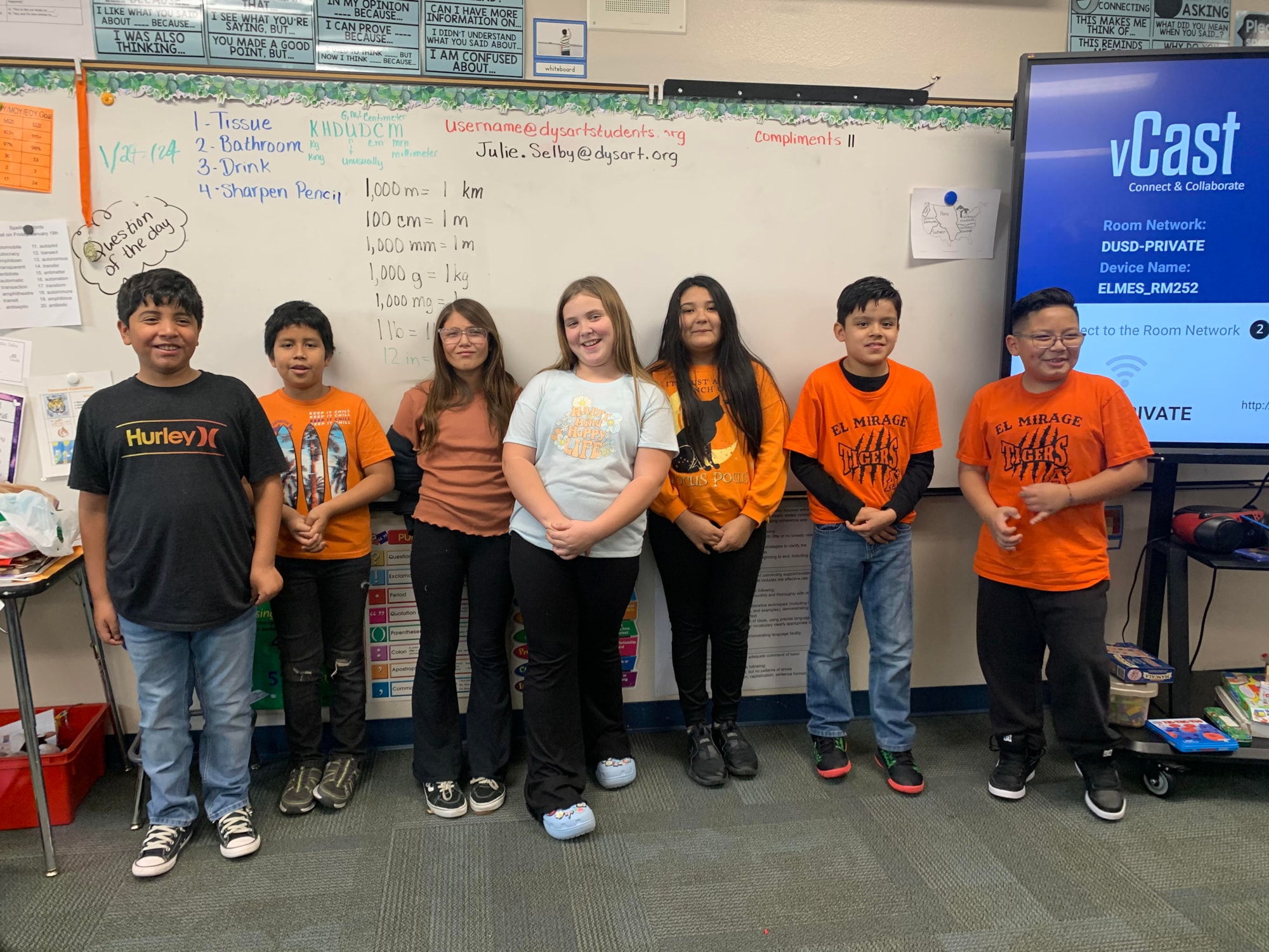Students wearing orange and black.