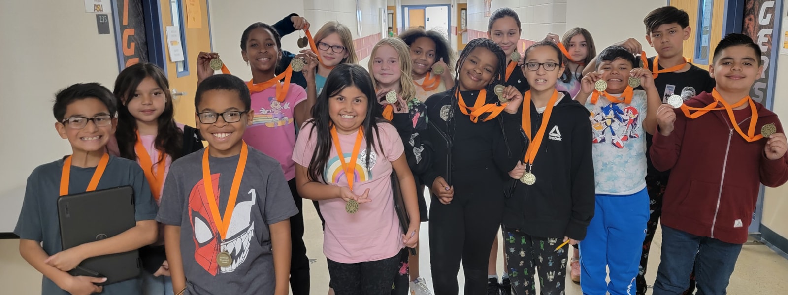 Students with tiger medals.