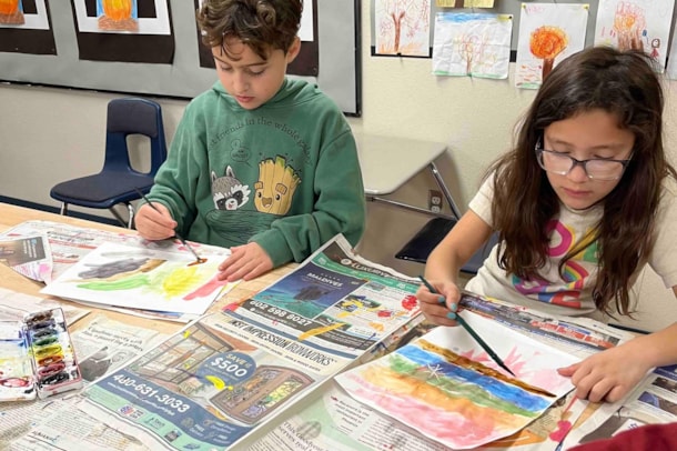Students painting in class