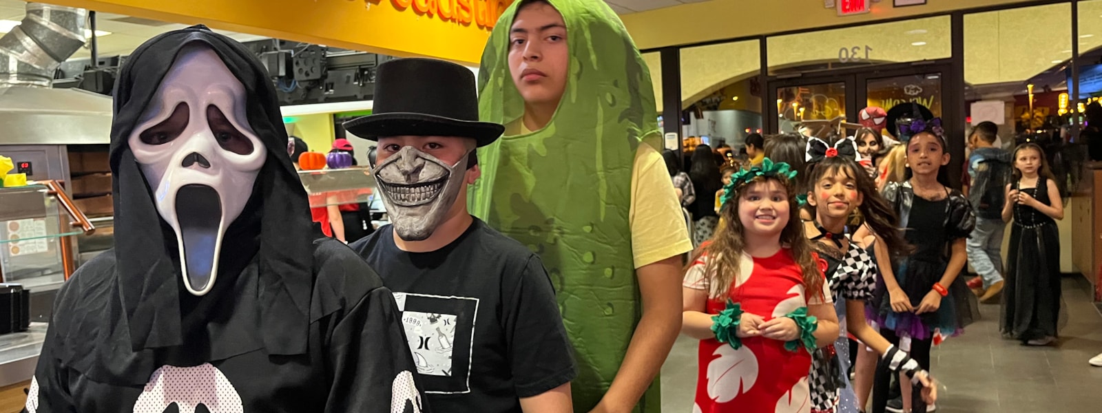 Students dressed up in costumes at Peter Piper Pizza Boo Bash