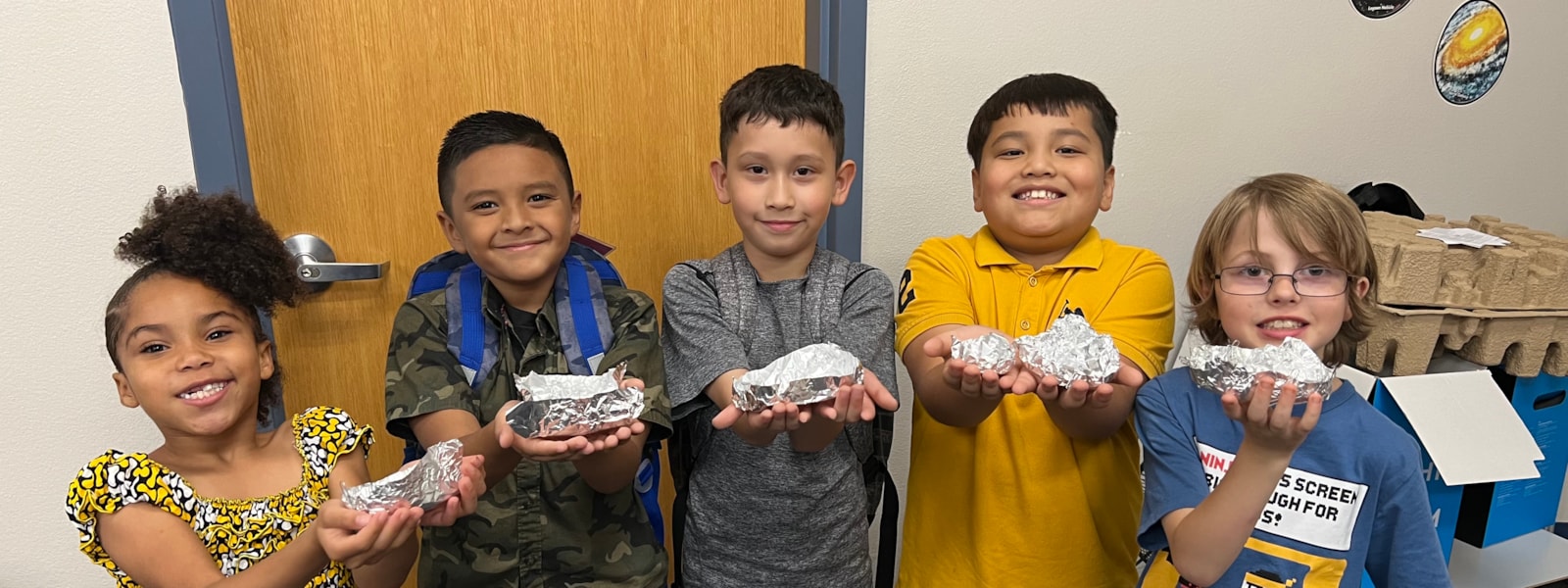 Students in iExplore with foil boats