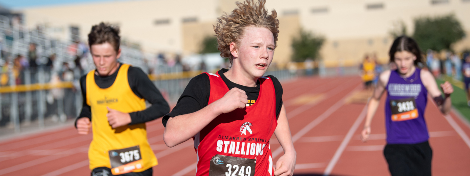 Student running in cross country race.