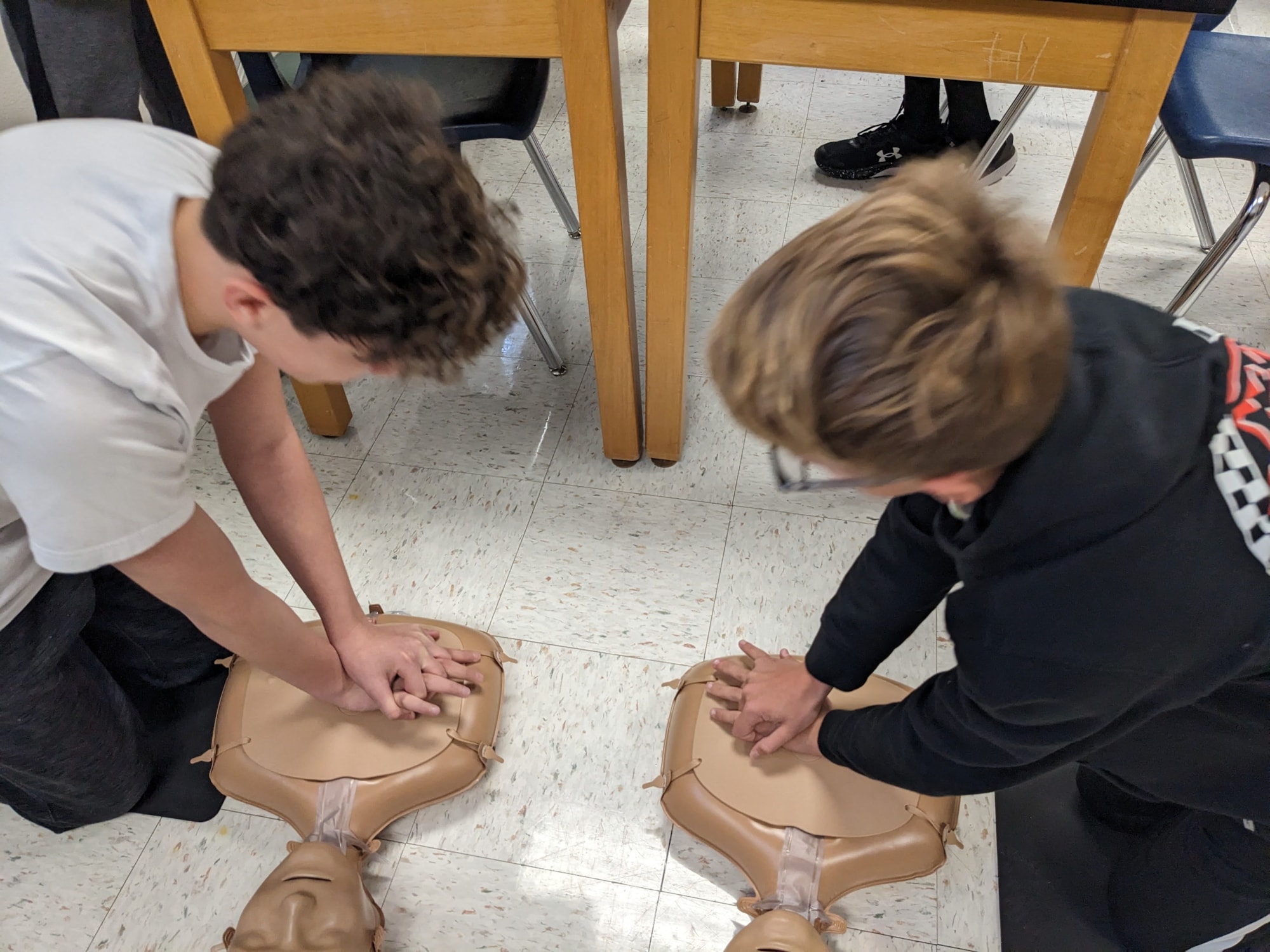 Students practicing hands only CPR
