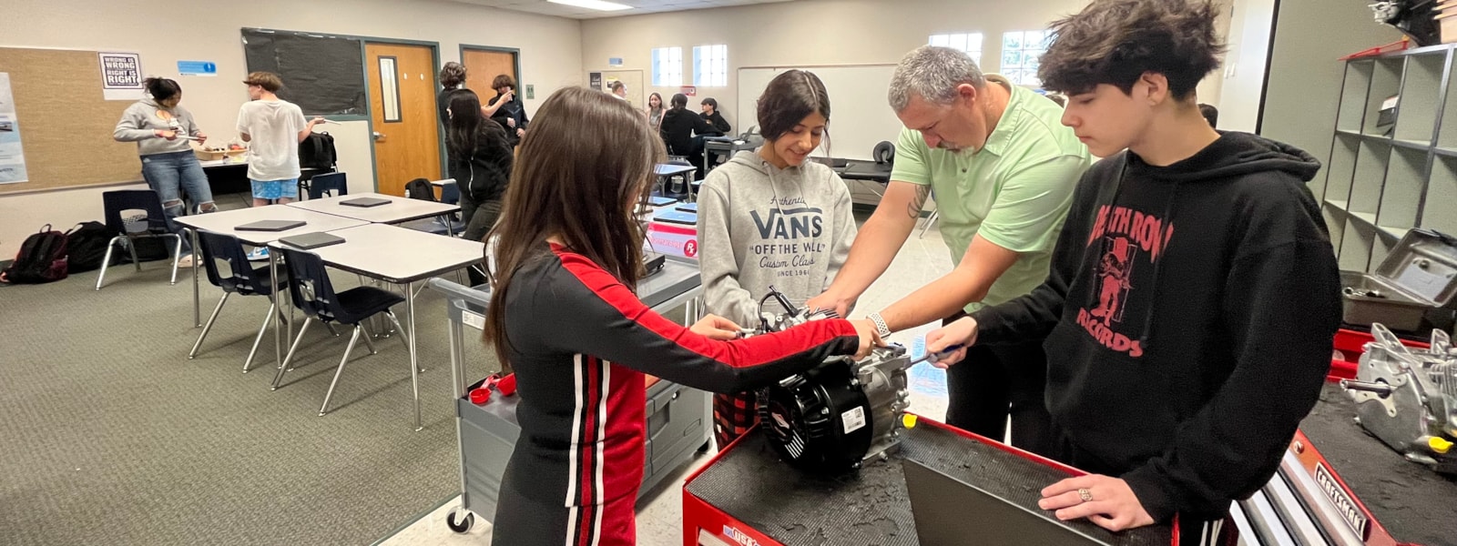 8th Grade students in CTE explore mechanics by building an engine