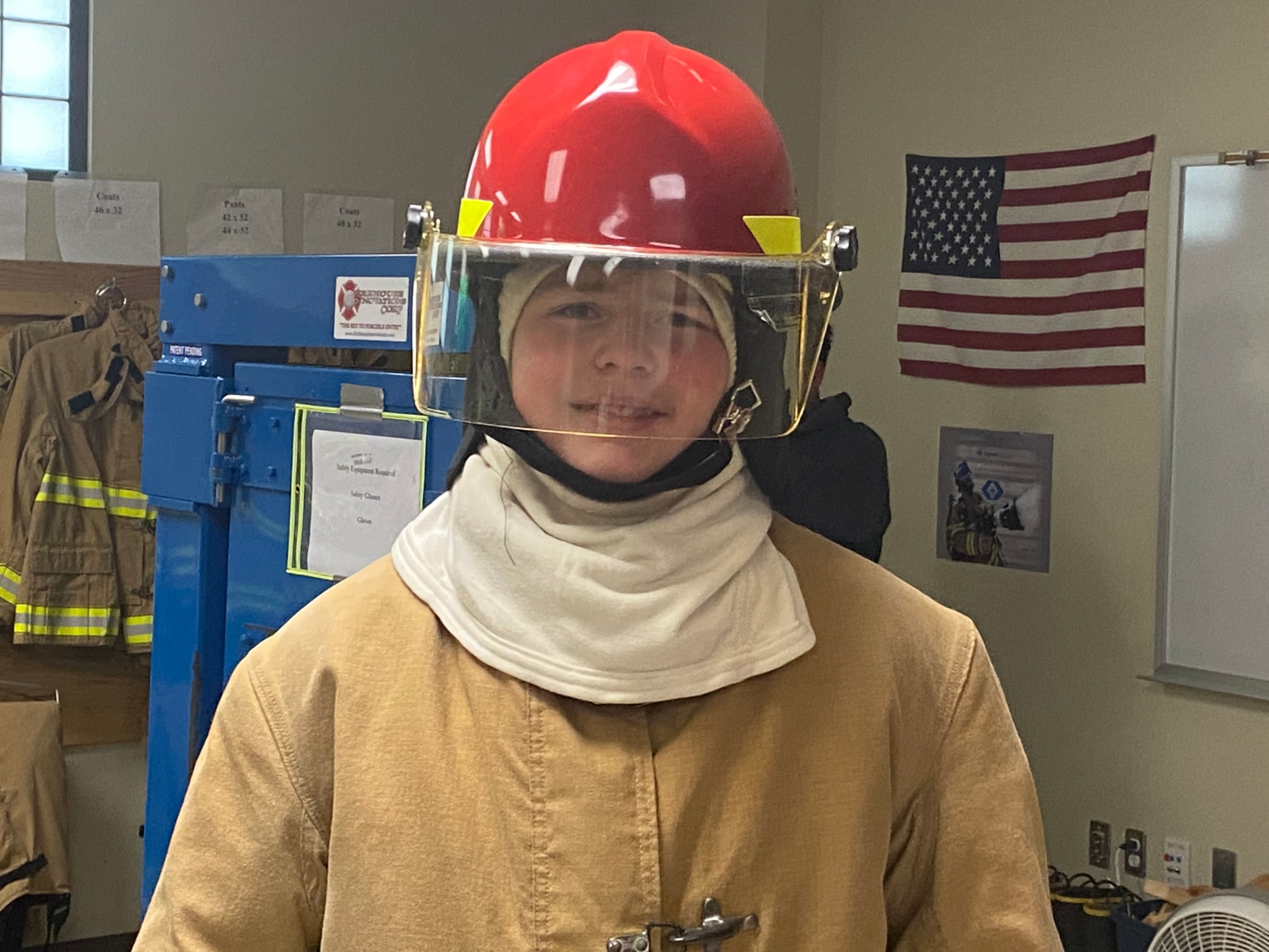 Student poses with Fire gear on