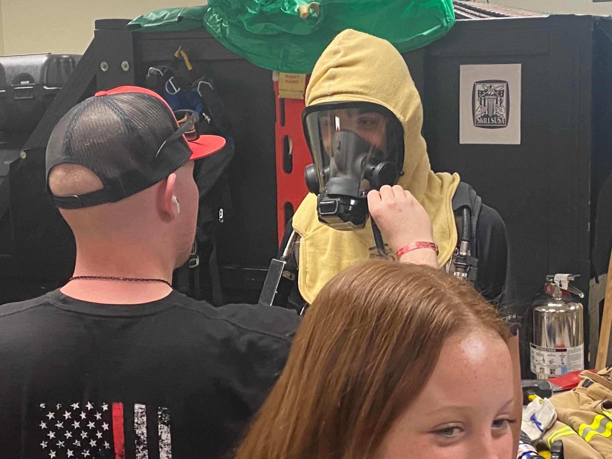 Student tries on Fire gear
