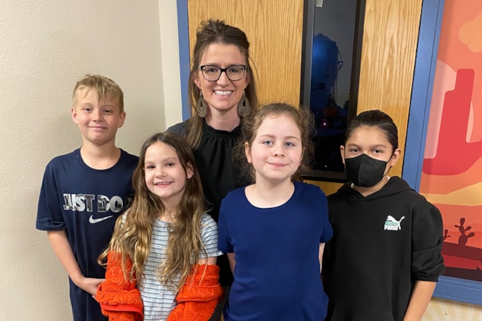 Ashley Meyer with with her kids and students
