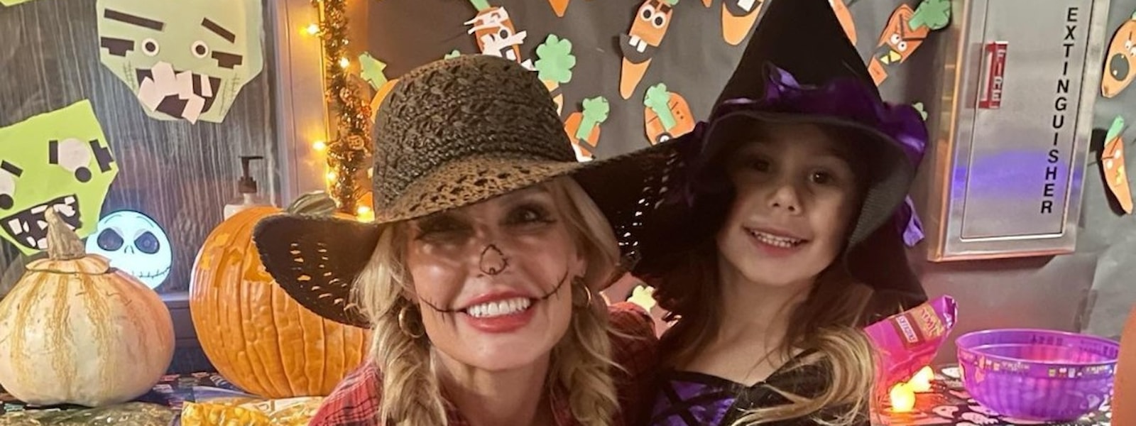 Parent and daughter in Halloween costumes