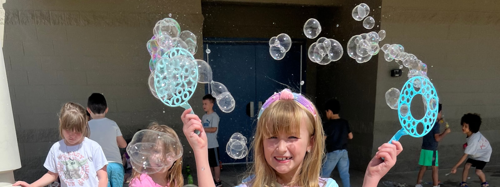 Students playing with bubbles