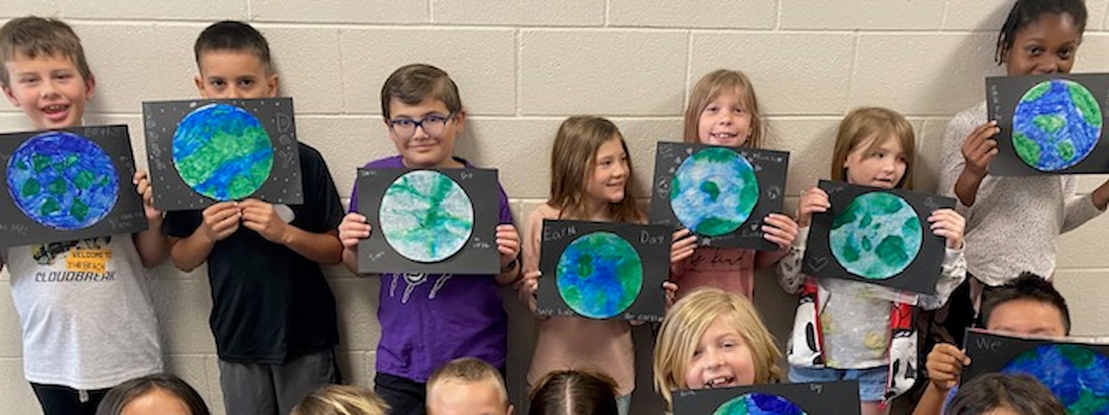 Third Grade students with their earth pictures