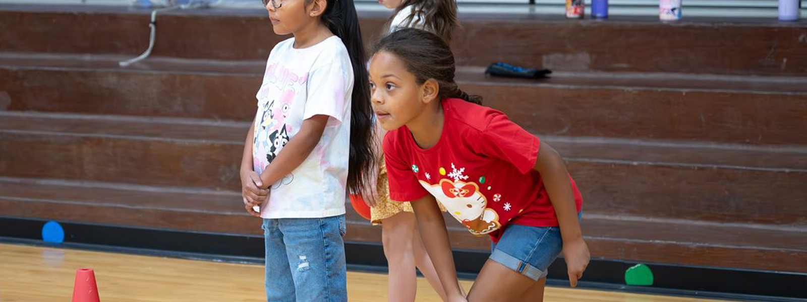 Student in a gym getting ready to run