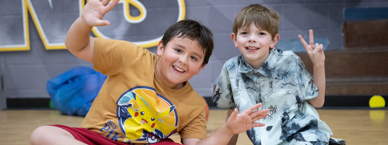 Students posing in the gym