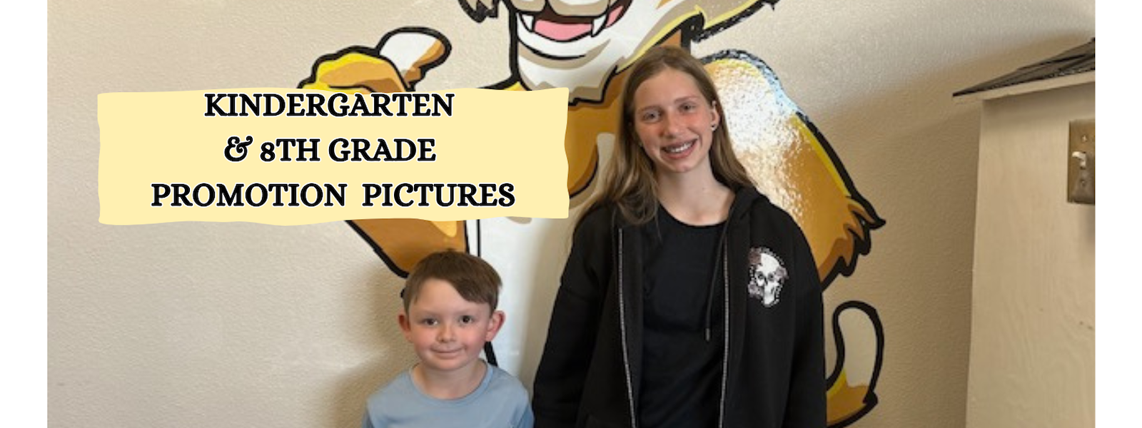 2 students by a mountain lion image with words Kindergarten & 8th grade promotion pictures
