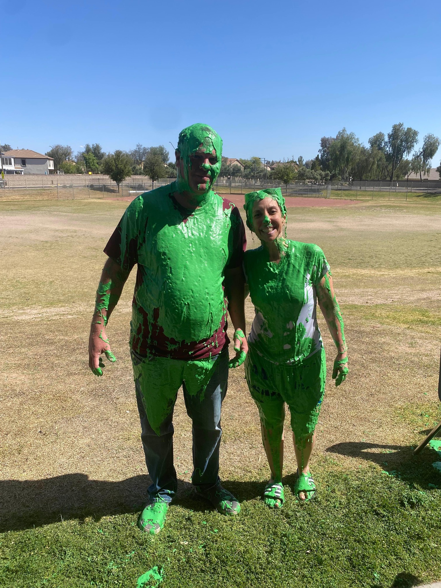 Principals standing together with slime on them