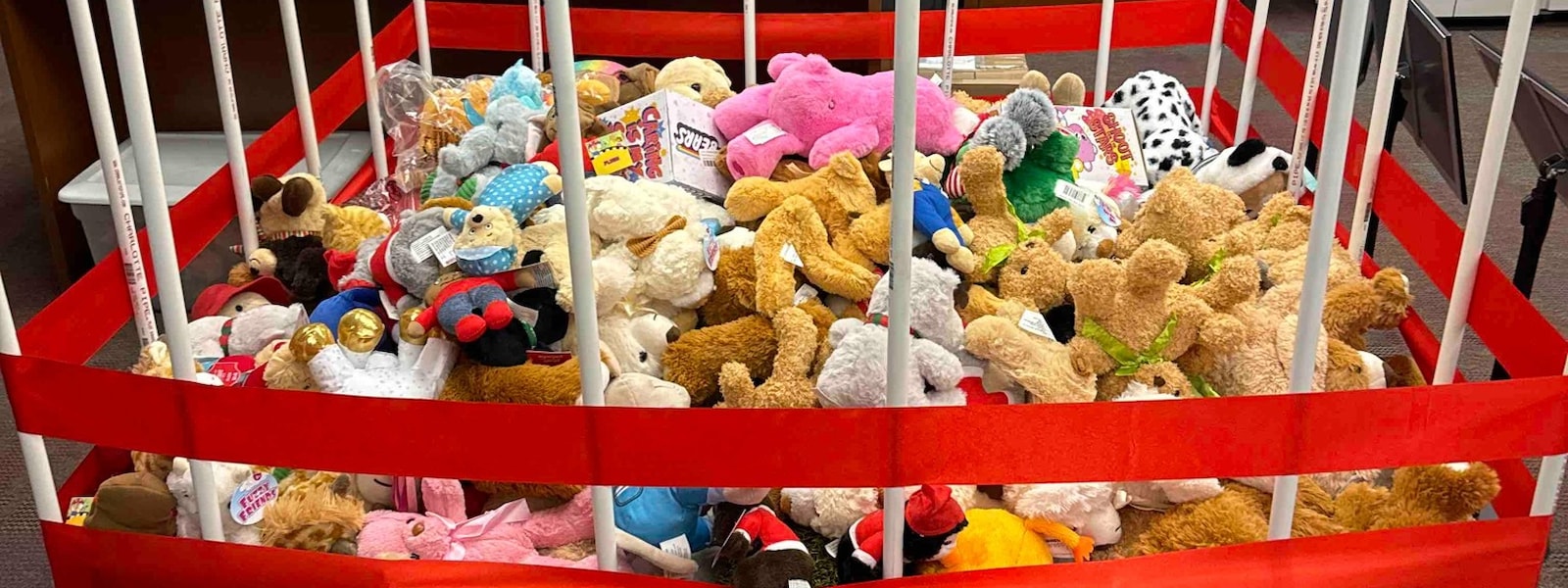 stuffed animals in a pvc pipe cage